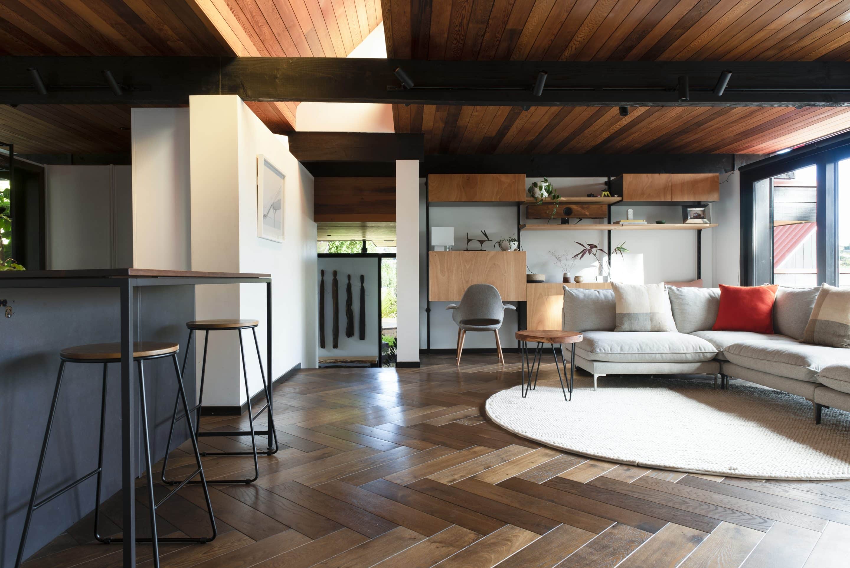 Rich brown oiled herringbone oak parquet in an open-plan living space, Flamingo Himalaya