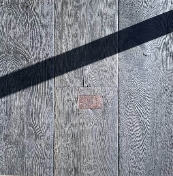 European made timber floor heavy textured with repair patches dark oak