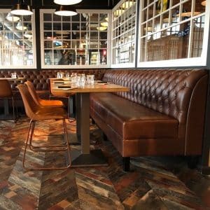 Antique Floors Wagon Timber chevron flooring shown as wood floor in cafe bar