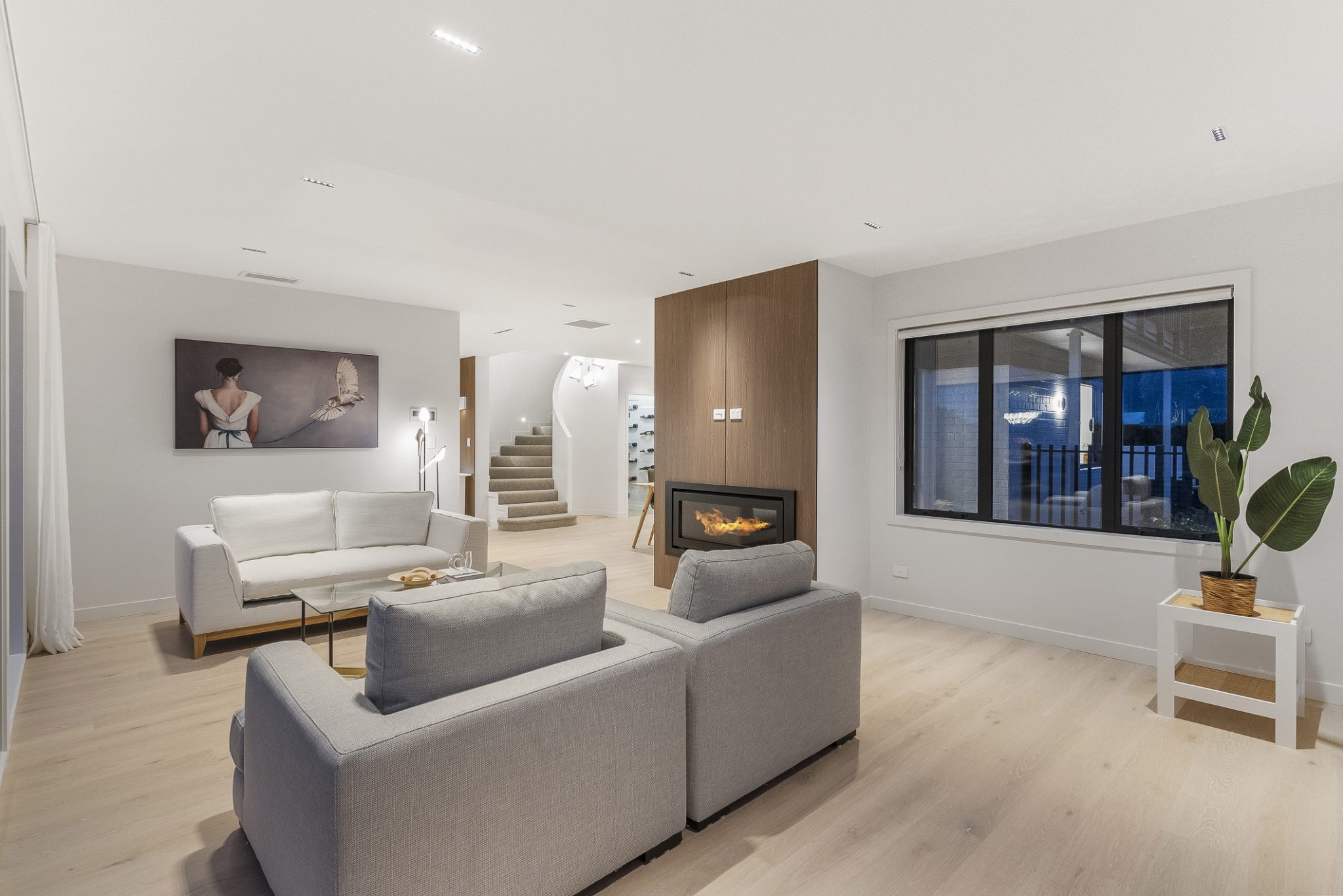 Foundation Empire oak flooring in a Parnell living room with a fireplace