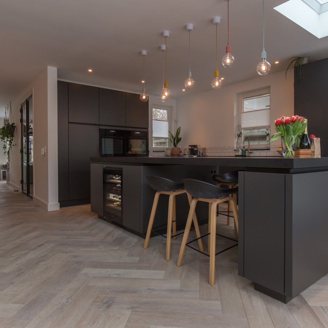Rustic texture herringbone wood flooring in kitchen area