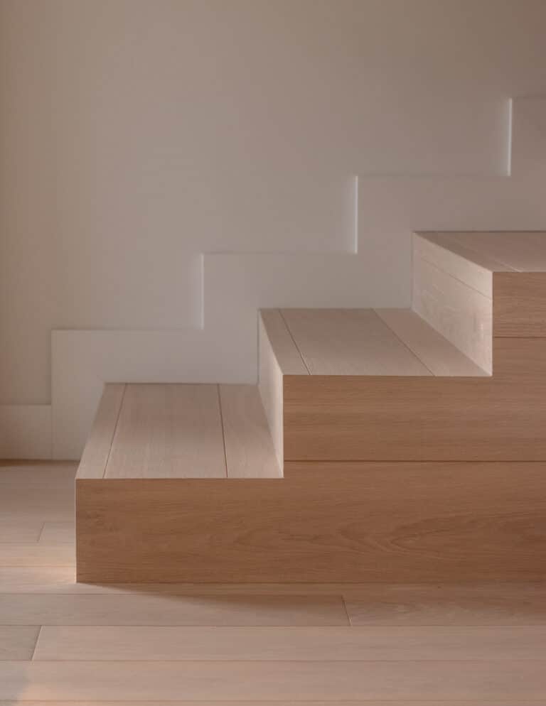 Greenbelt House Stairs, showcasing Vienna Woods Sazerac Prime Grade Wood Flooring