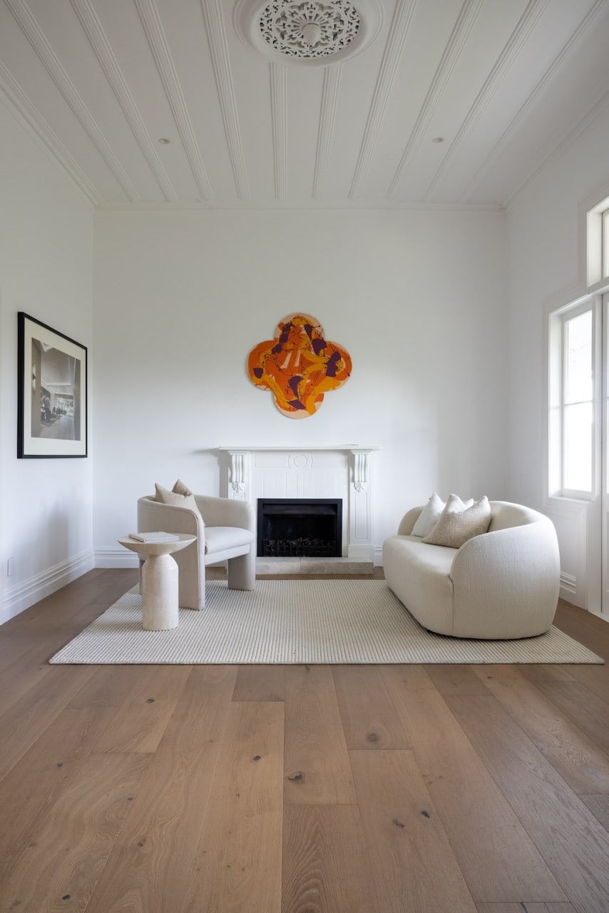 Long and wide natural oak wood flooring planks in open lounge