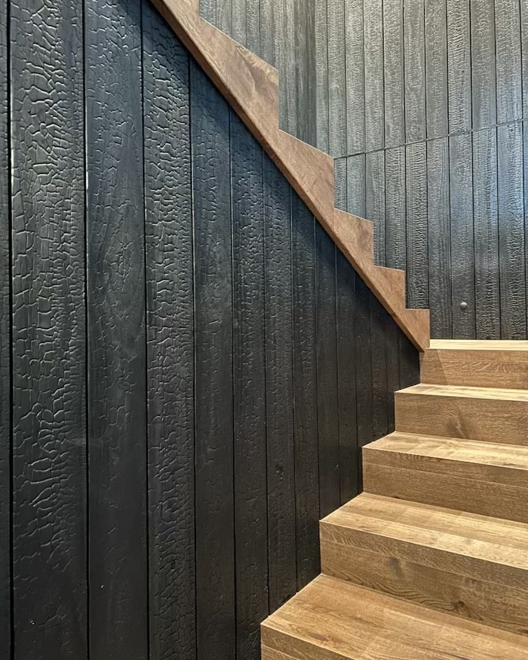 Engineered European oak timber stairs with zig zag side stringer and textured wall