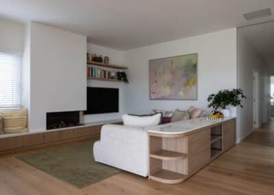 TV nook with built-in shelving and Bordeaux European oak timber flooring in Auckland home