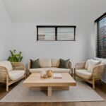 Wide plank European oak flooring in a secondary living room with lounge seating, timber coffee table and window blinds in a Queenstown New Zealand home