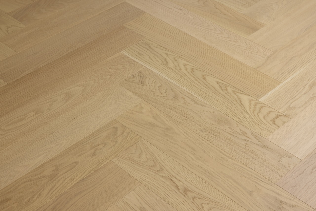 Close-up detail of prime grade Bordeaux engineered European oak herringbone flooring