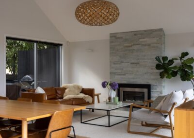 Wide view of dining and living spaces with Bordeaux herringbone oak flooring in Westmere home