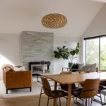 Wide view of dining and living spaces with Bordeaux herringbone oak flooring in Westmere home