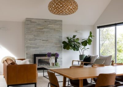 Wide view of dining and living spaces with Bordeaux herringbone oak flooring in Westmere home
