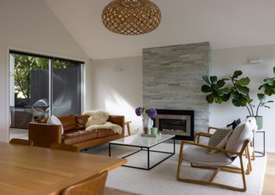 Bordeaux herringbone oak flooring in a living room with fireplace, Westmere home