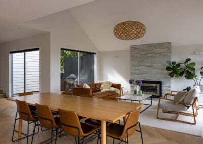 Open plan living and dining area with Bordeaux herringbone oak flooring in Westmere home