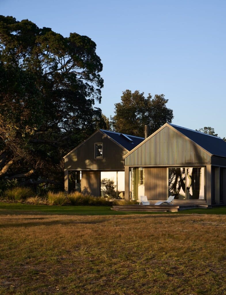 Modern coastal architectural home exterior with timber cladding and gable roof design in Coromandel