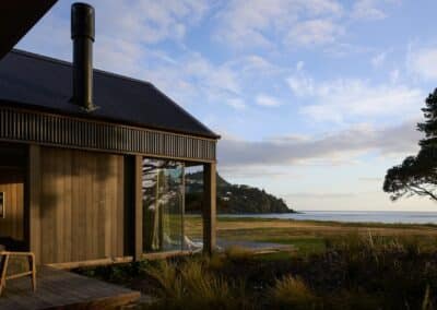 Coastal architectural home exterior in Coromandel with timber cladding and ocean view setting