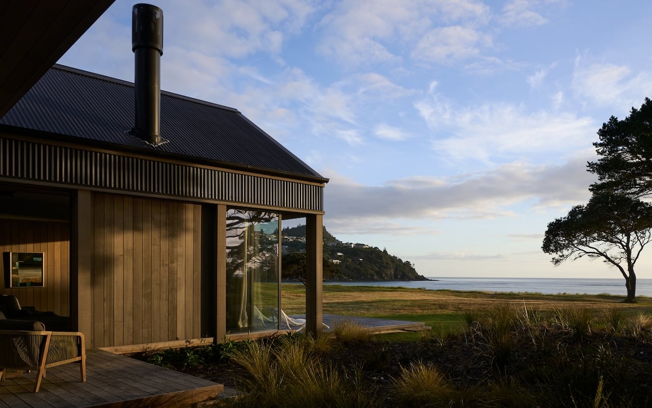 Coastal architectural home exterior in Coromandel with timber cladding and ocean view setting