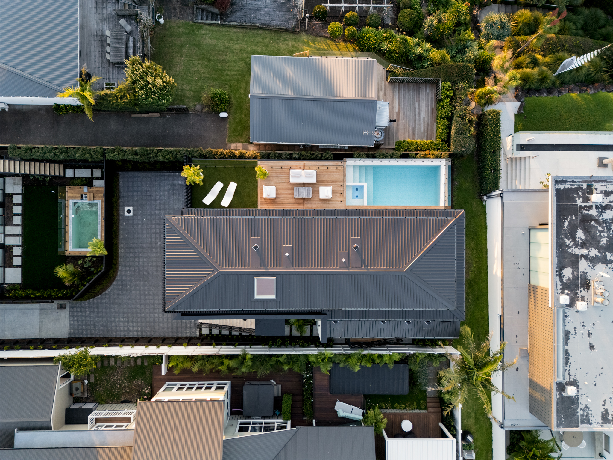 Aerial view of Westmere Auckland property showing pool and roofline.