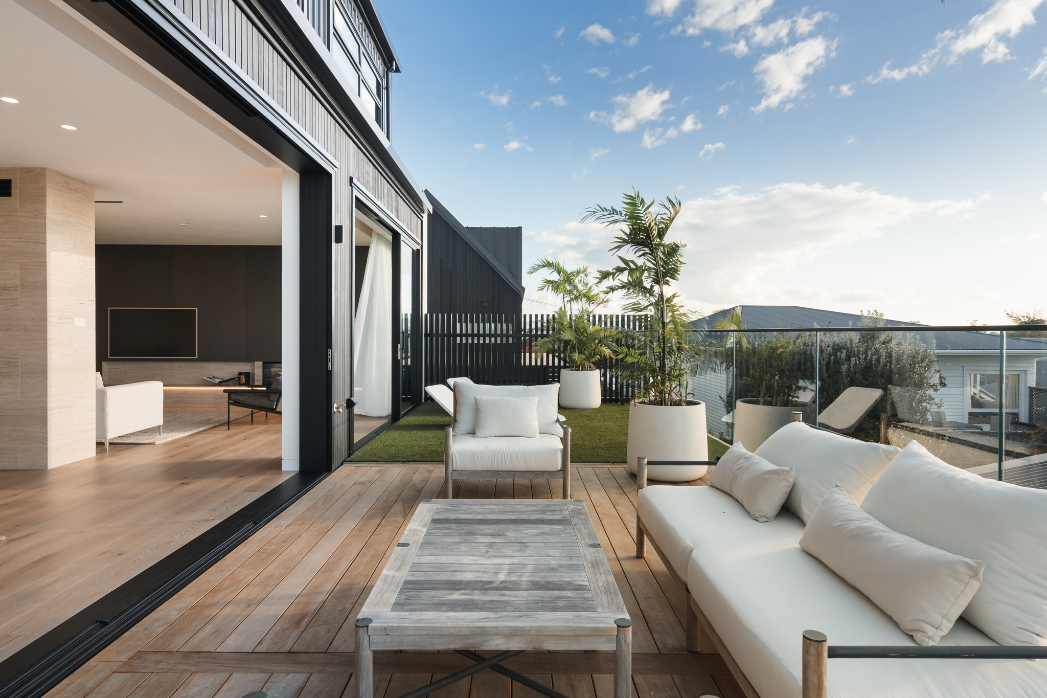 Outdoor deck terrace adjoining Westwood engineered oak interior, Westmere Auckland.