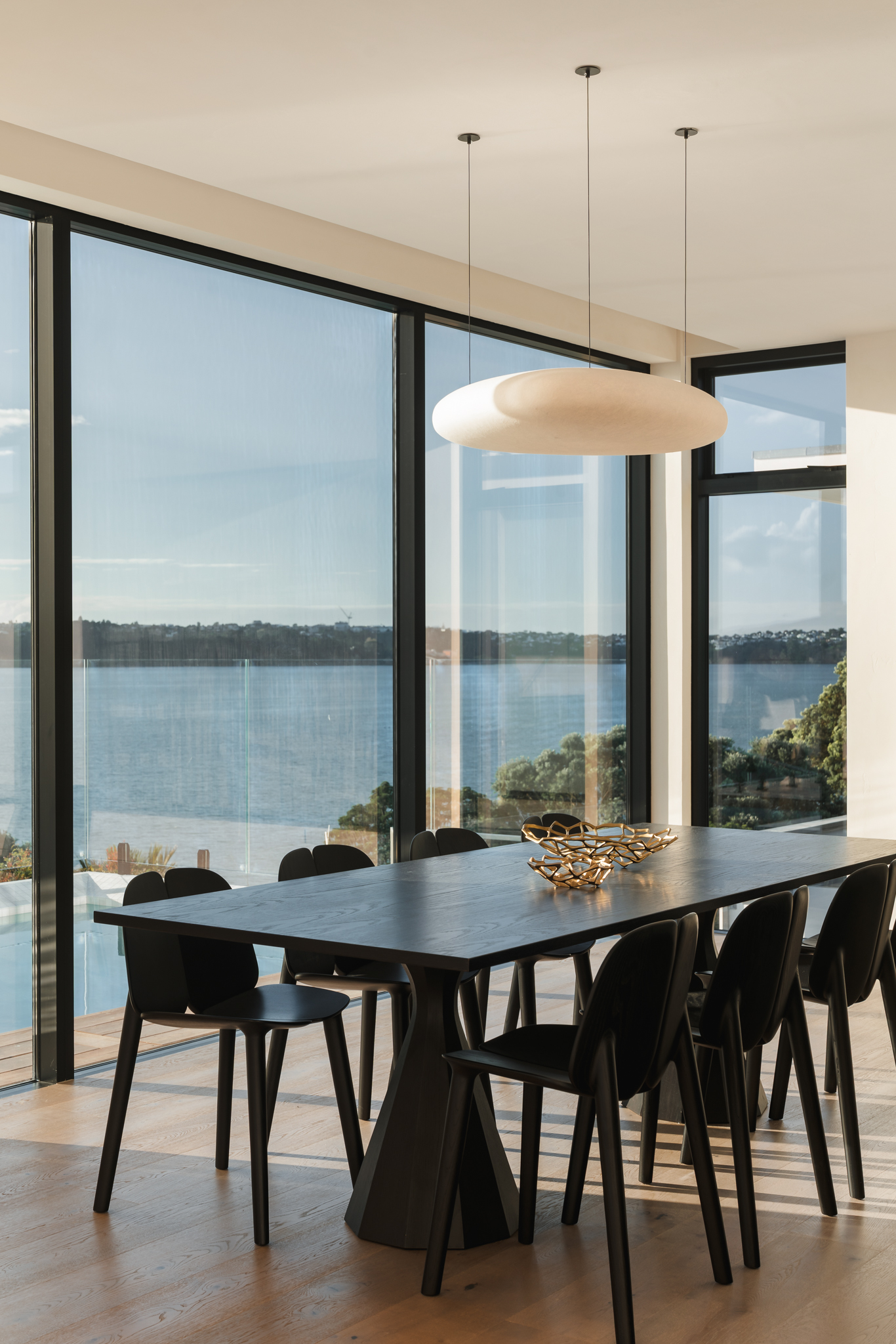 Westwood engineered European oak in a dining area opening to the Westmere harbour view.