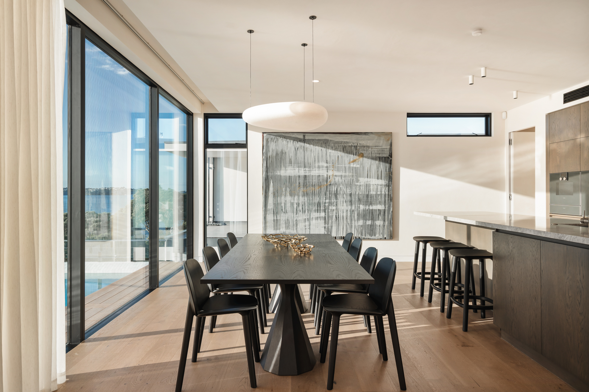 Westwood engineered oak flooring in a dining room with Auckland harbour view, Westmere.