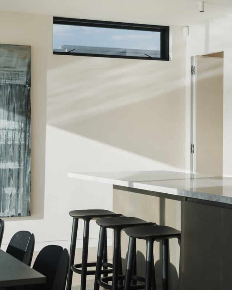 Westwood engineered oak flooring with built-in dining bench and kitchen island, Westmere Auckland.