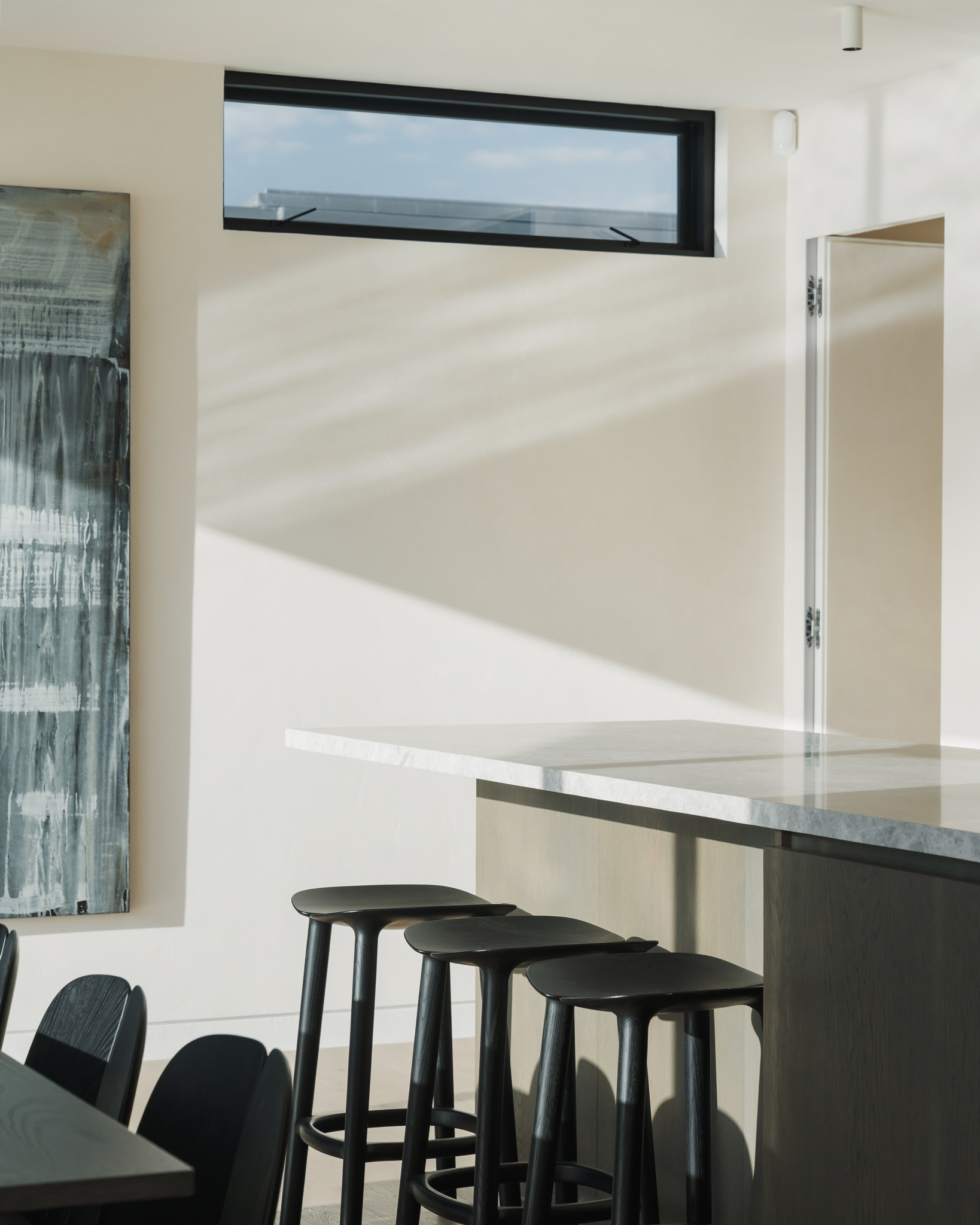 Westwood engineered oak flooring with built-in dining bench and kitchen island, Westmere Auckland.