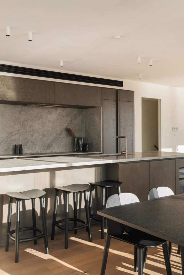 Wide view of Westwood engineered European oak flooring through kitchen and dining, Westmere Auckland.