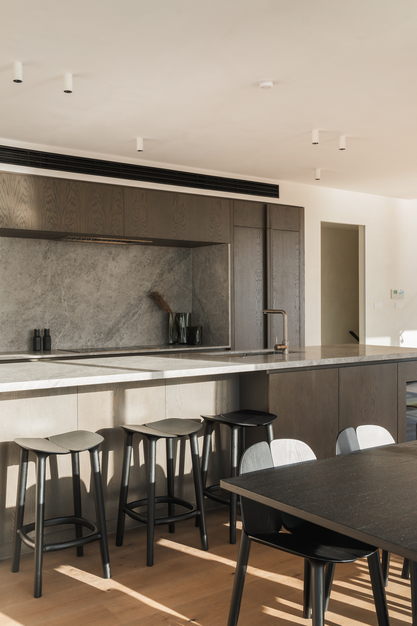 Wide view of Westwood engineered European oak flooring through kitchen and dining, Westmere Auckland.