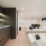 Westwood engineered oak flooring in lower lounge with kitchenette, Westmere Auckland.