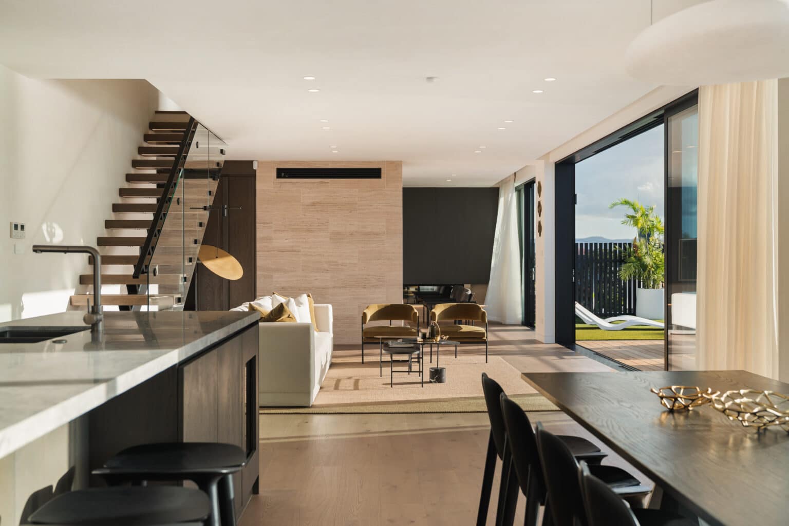 Westwood engineered oak flooring through an open-plan commercial-grade interior with a floating timber and steel stair, Auckland