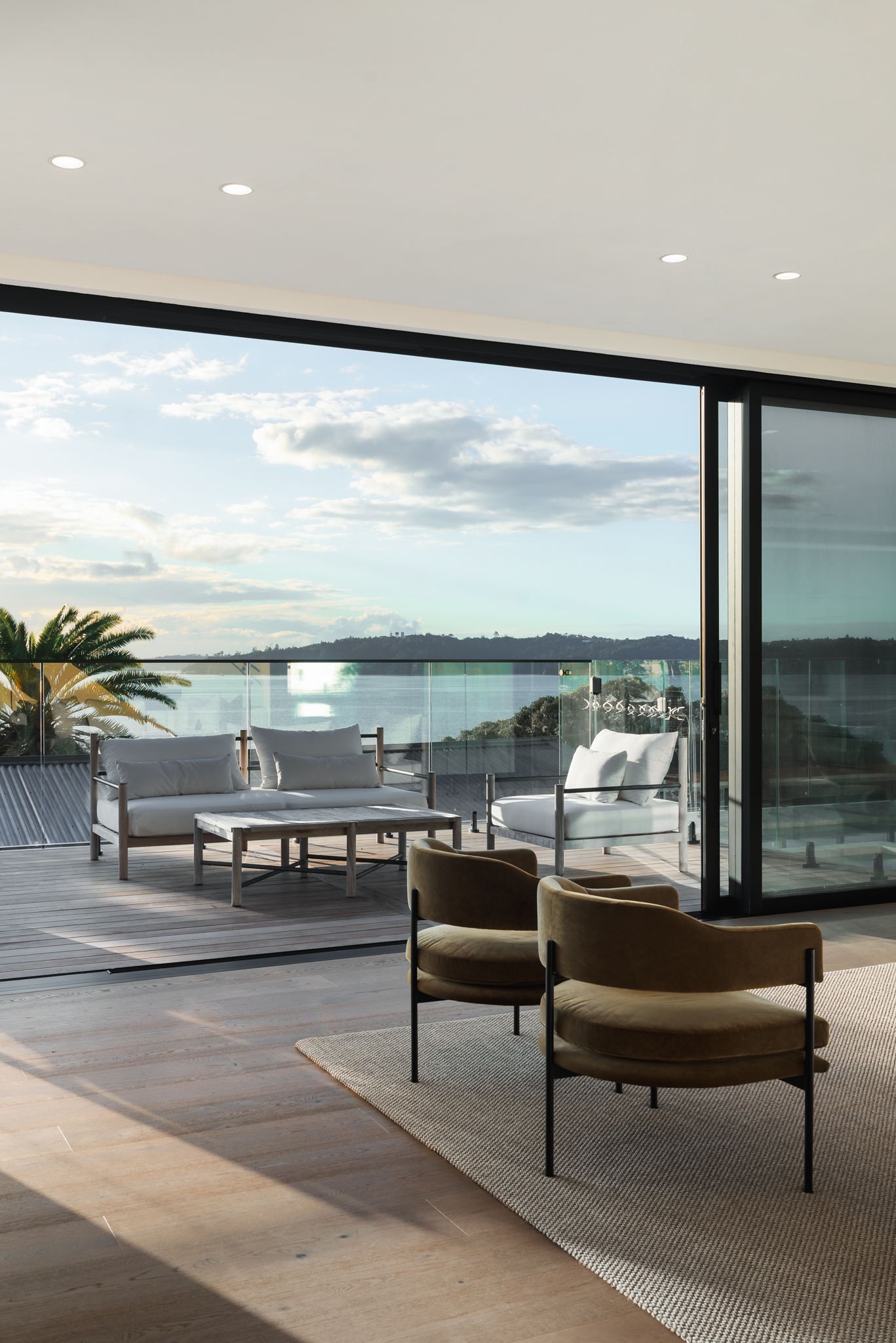 Outdoor terrace at a Westmere Auckland home with Westwood engineered oak floor extending inside.