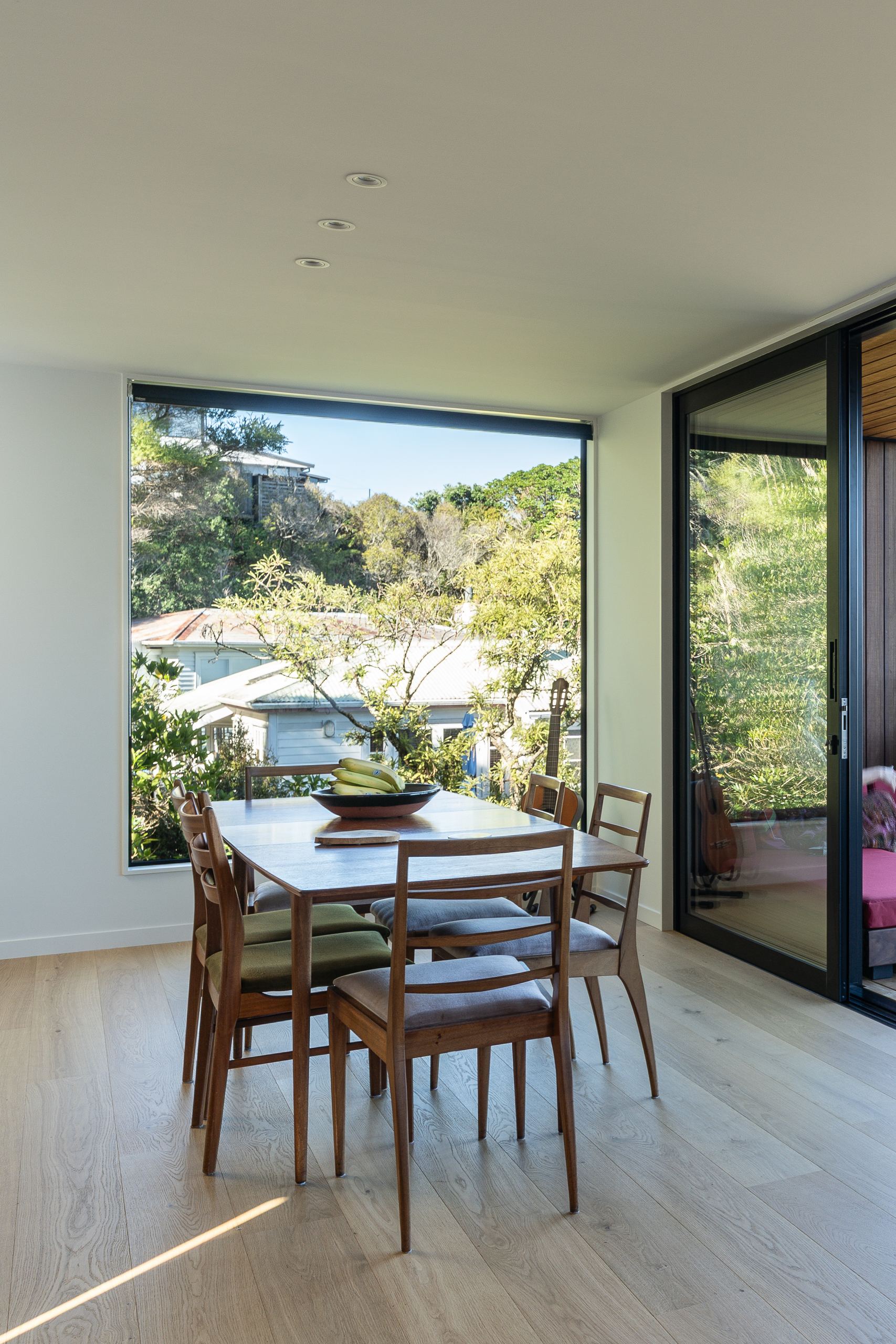Foundation Pureline oak flooring in a Hillsborough dining room with a square picture window.