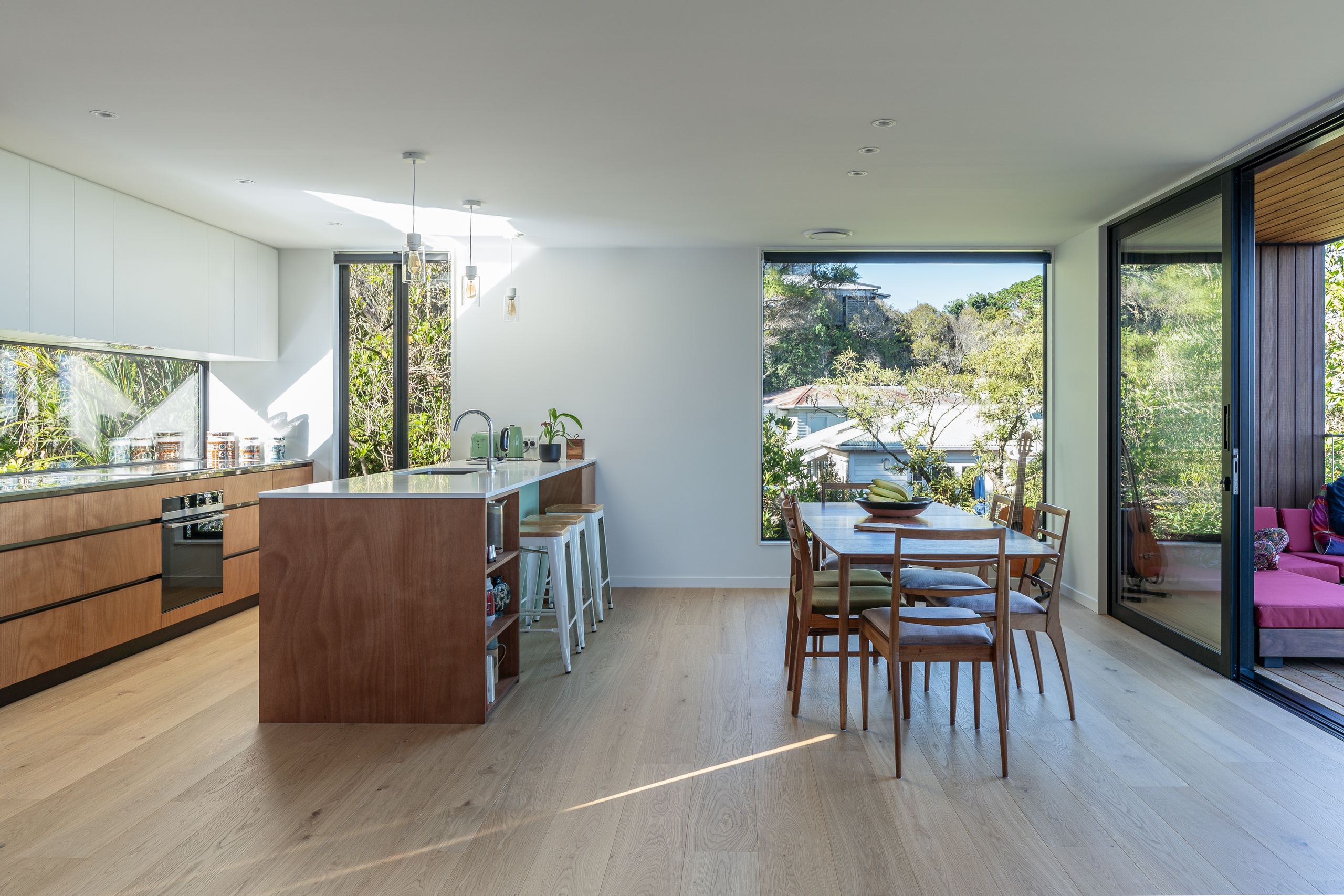 Foundation Pureline oak flooring through an open-plan kitchen and dining room in a Hillsborough new build.