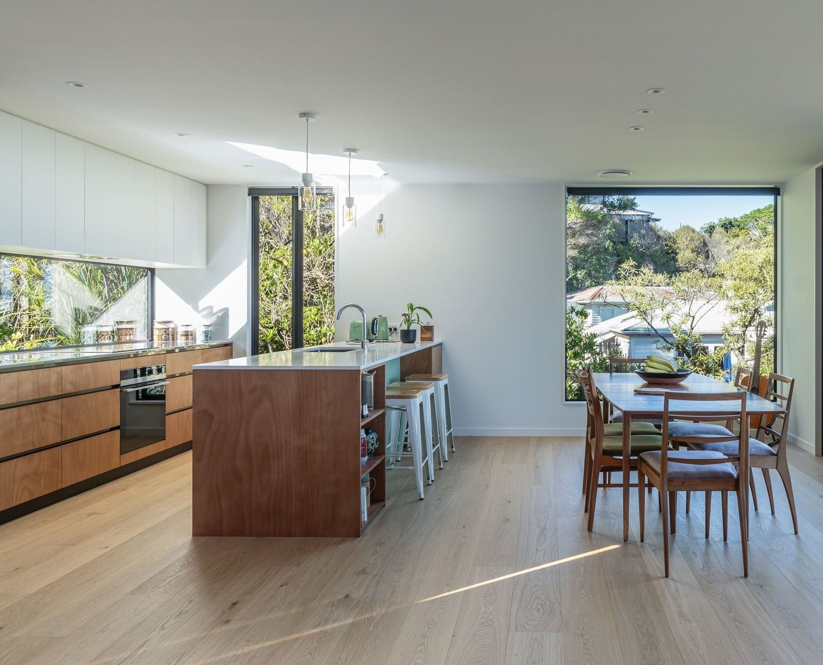 A Vienna Woods engineered oak floor in an open-plan kitchen and dining space