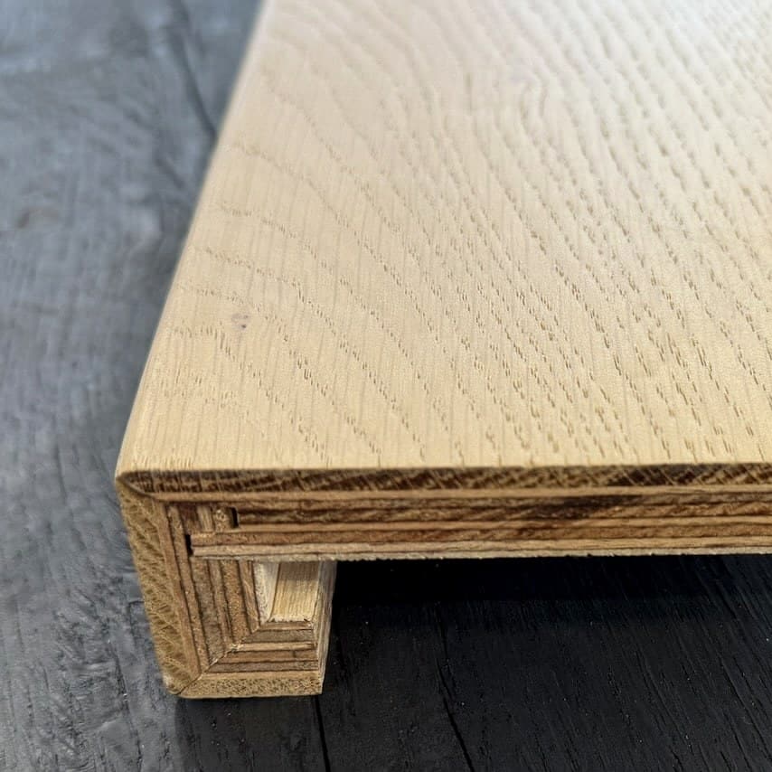 End profile of a Vienna Woods oak stair nosing showing the rounded front edge and the formed return